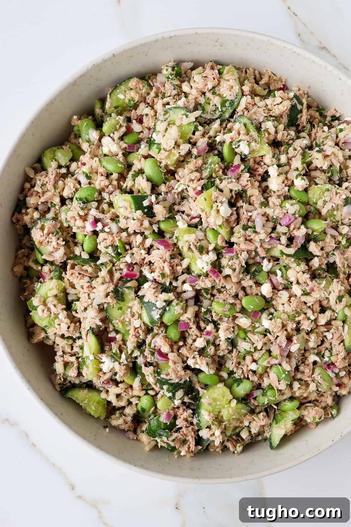 Protein-Packed Tuna, Cucumber and Edamame Salad Recipe 3 Close up side shot of the salad in a bowl.