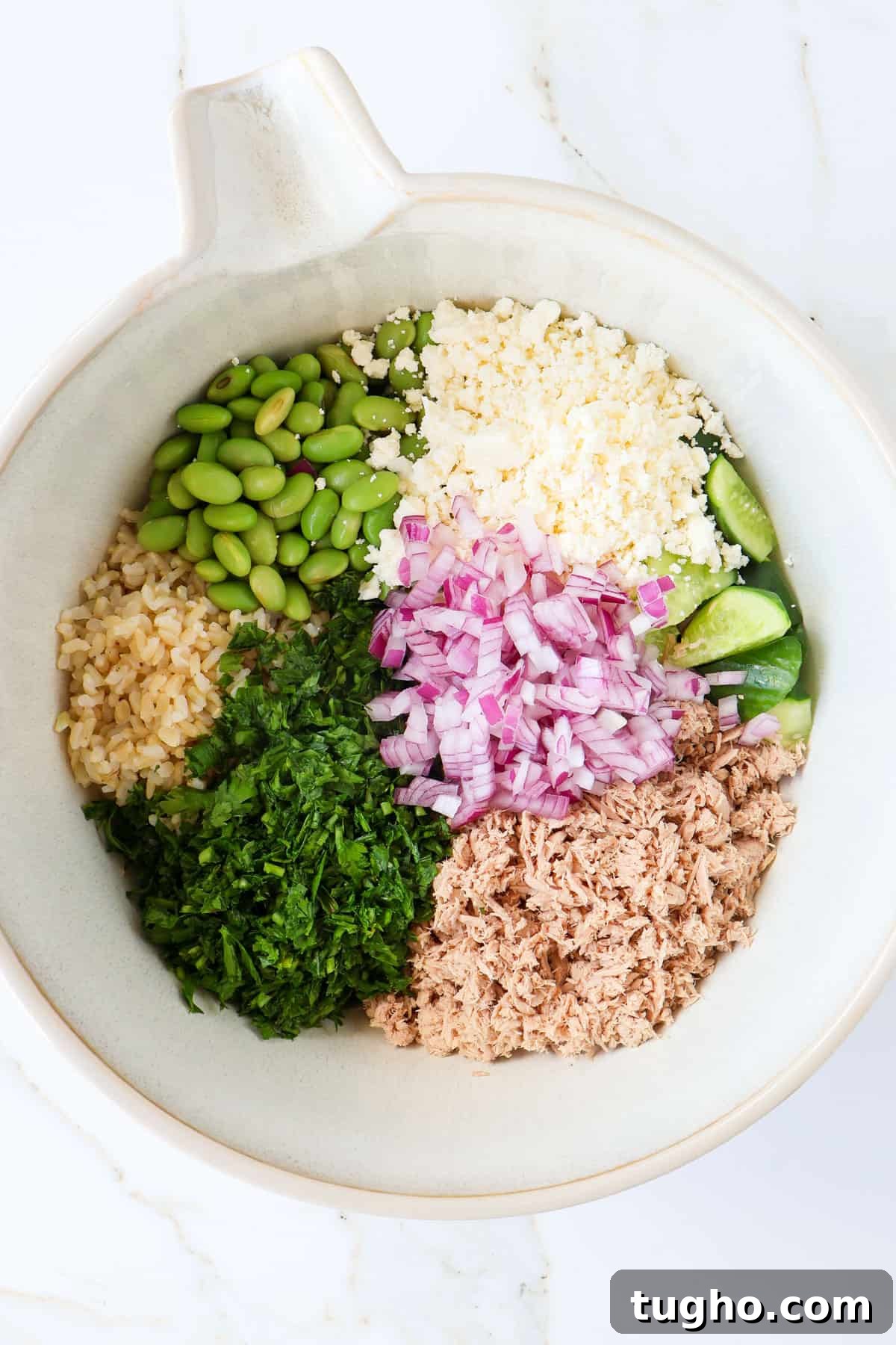 Protein-Packed Tuna, Cucumber and Edamame Salad Recipe 6 Ingredients in a large mixing bowl.