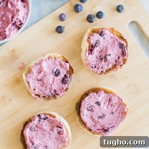 30 Minute Dinner Recipes for Busy Weeknights 12 Four slices of toasted bread spread with blueberry cream cheese sit on a wooden cutting board. A bowl with more of the spread and a scattering of fresh blueberries are nearby.