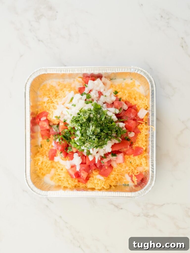 Smoked Queso Dip: Creamy, Smoky Recipe for Parties 4 all ingredients for smoked queso dip in an aluminum pan