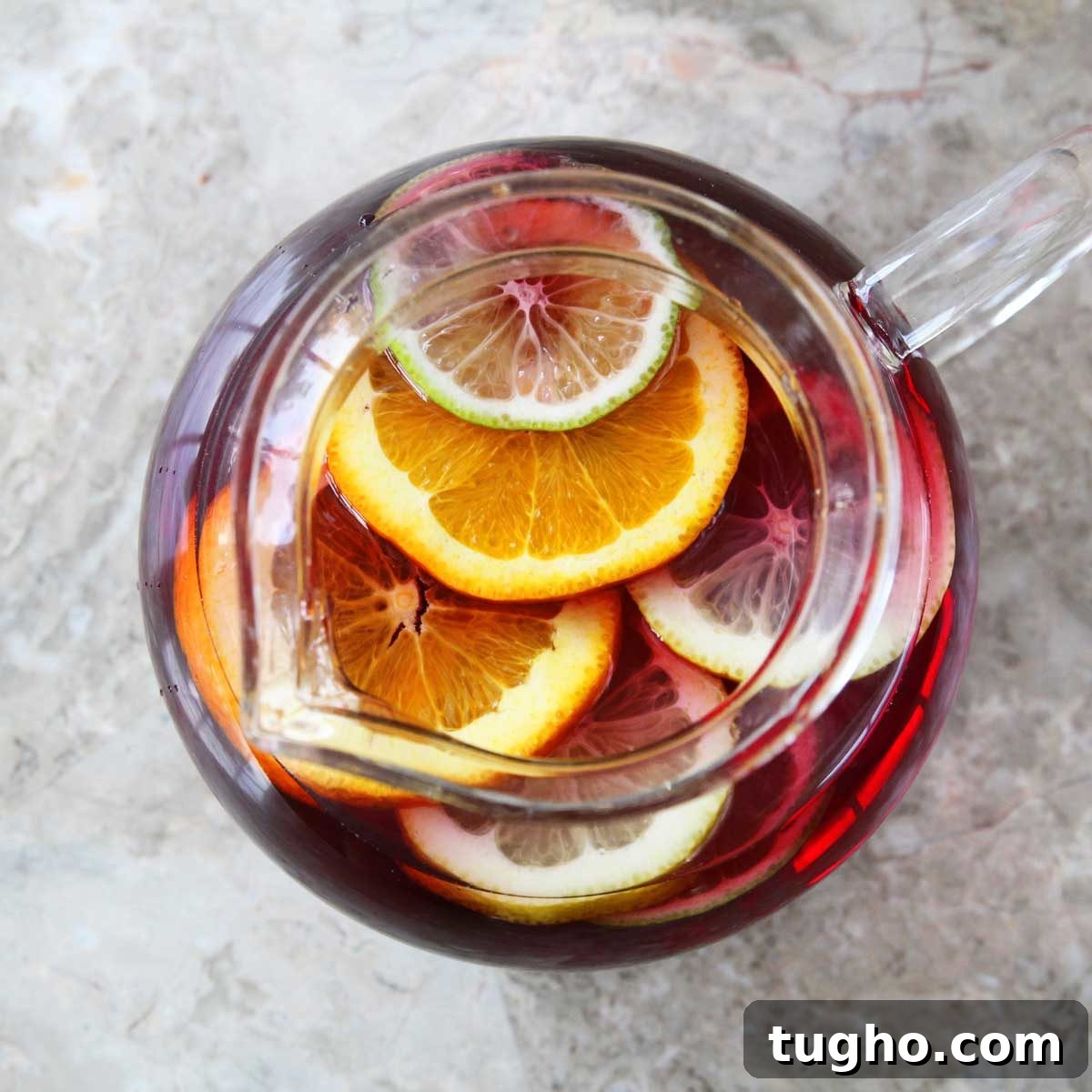 Non-Alcoholic Sangria Mocktail Recipe 4 Pitcher and glasses of sangria on table
