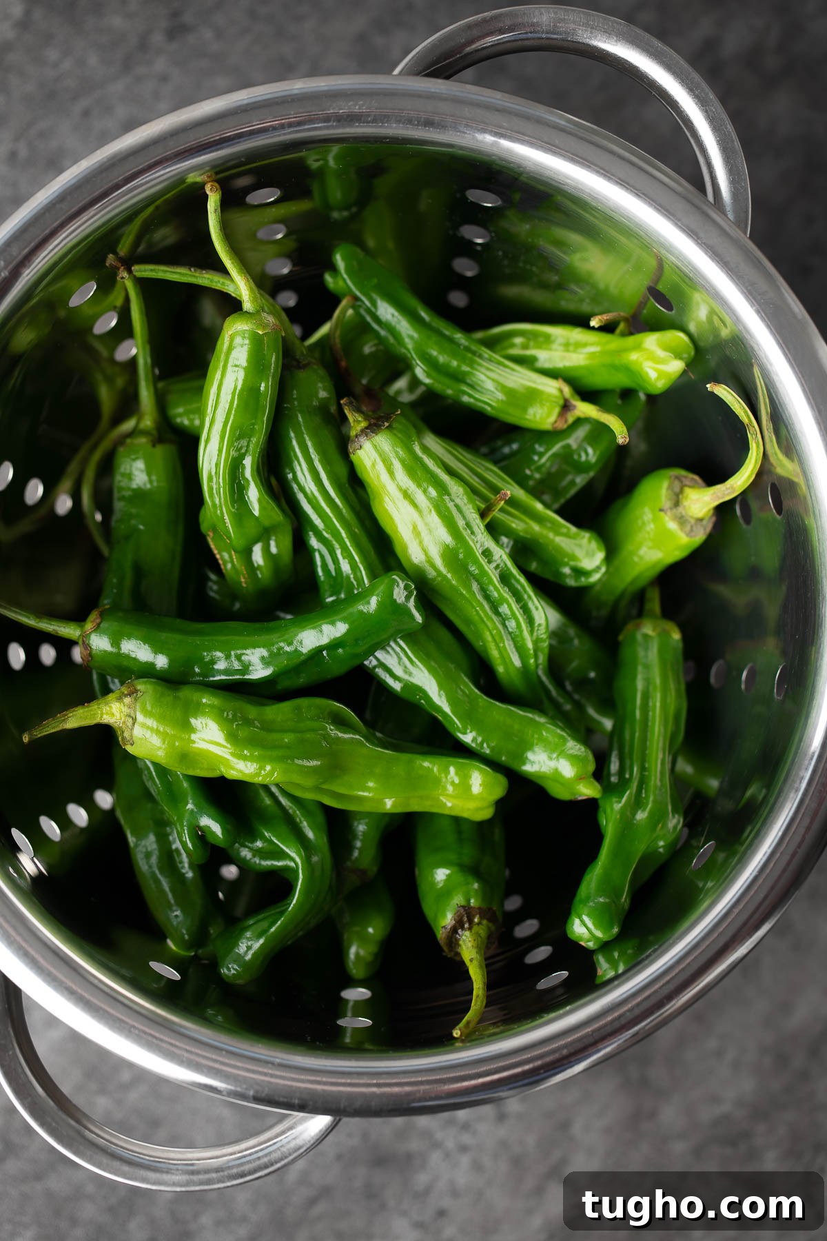 Blistered Shishito Peppers with Spicy Dipping Sauce Recipe 3 shishito peppers in a colander