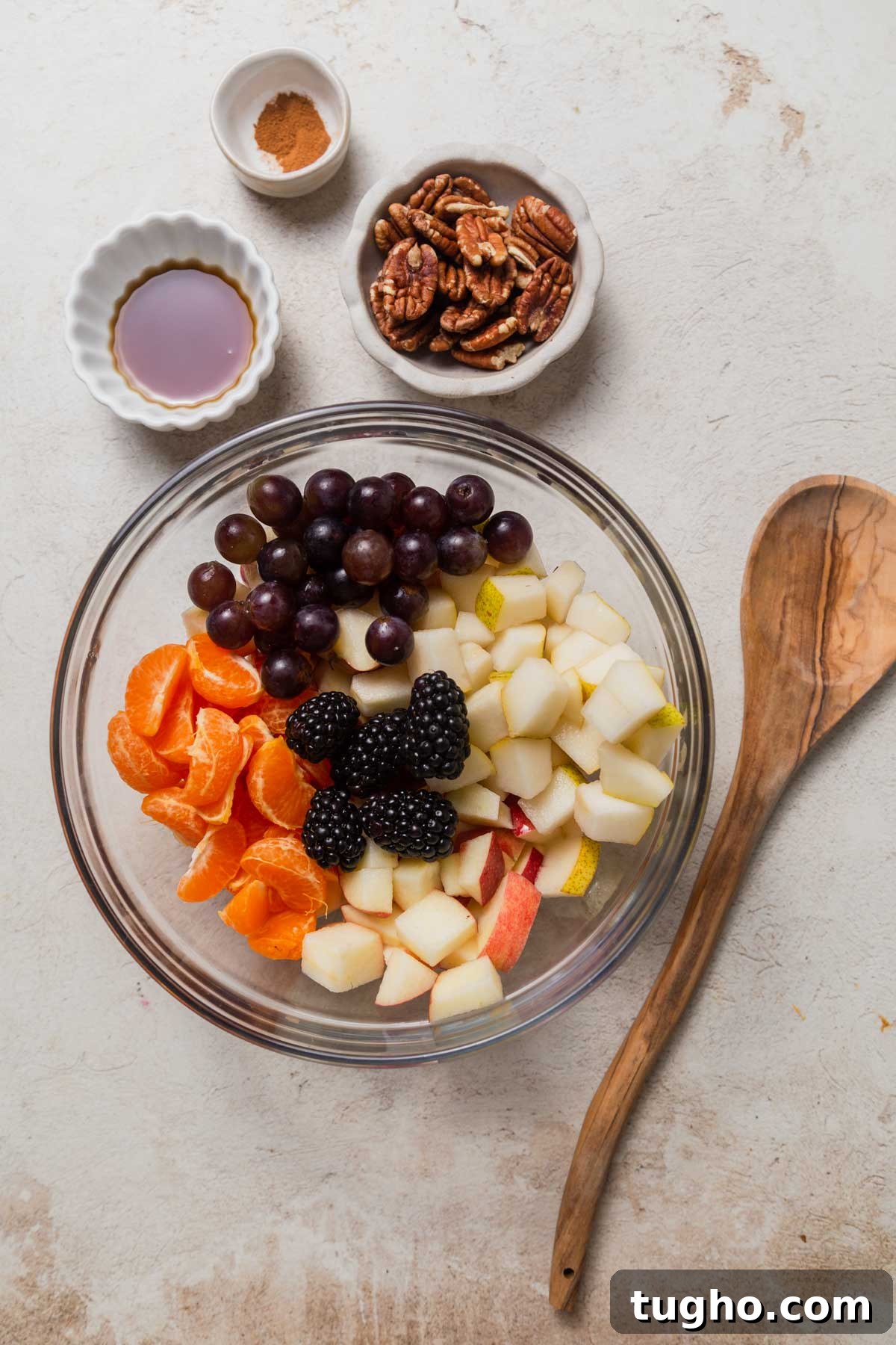 fruits cut up in a bowl for the fall fruit salad.