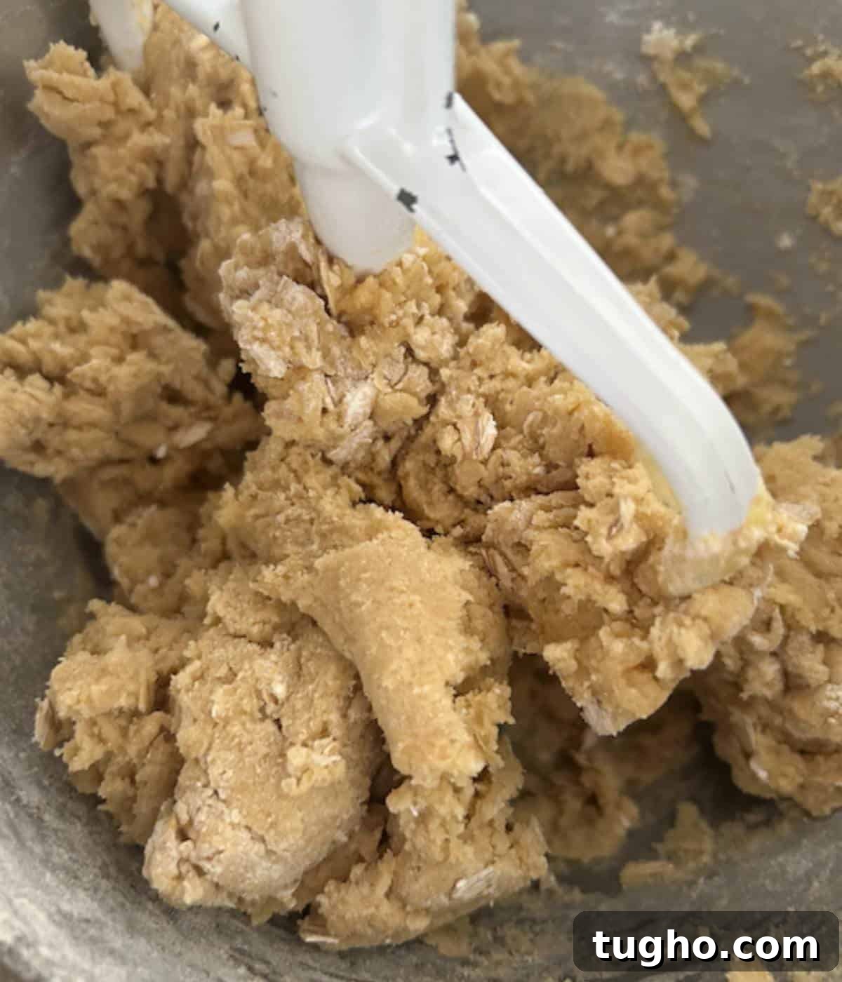 Cookie batter for coconut pecan cookies.