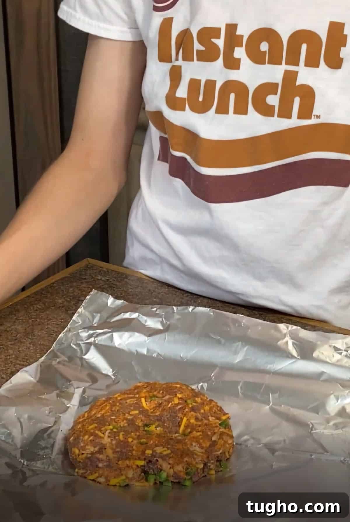 Venison Chorizo Burger with Cheddar and Jalapeno 5 raw venison burger placed in the center of a piece of foil