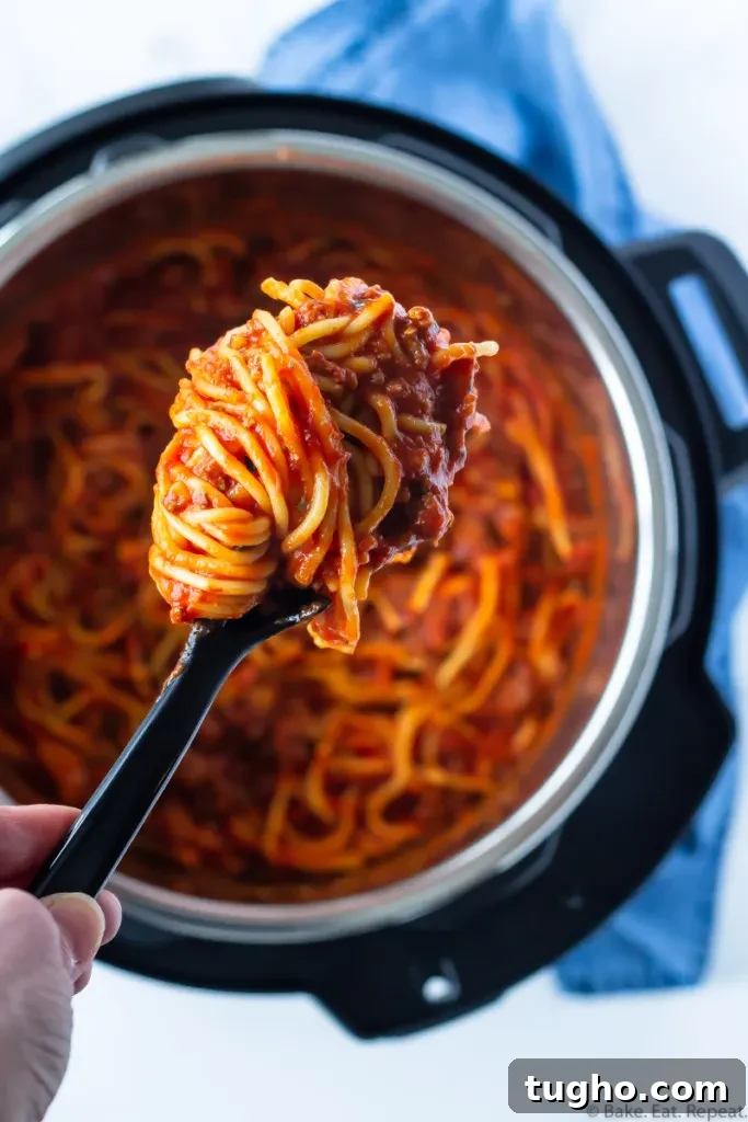 Instant Pot Spaghetti Recipe: Classic One-Pot Marinara 2 Spaghetti and meat sauce in the Instant Pot with a scoop of spaghetti.