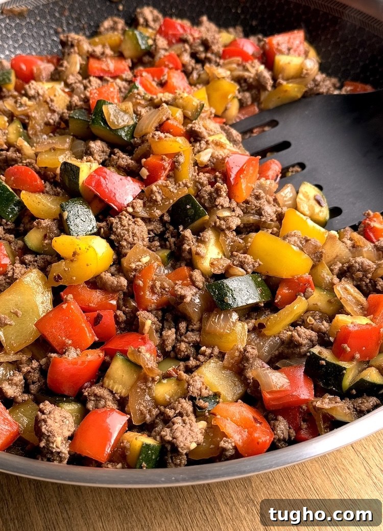Beef and Pepper Rice Bowls 8 One pound of browned ground beef and colorful chopped bell peppers in a skillet.