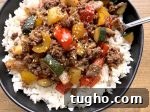 Beef and Pepper Rice Bowls 10 Asian style ground beef and bell pepper stir fry over white rice in a simple homemade sauce.