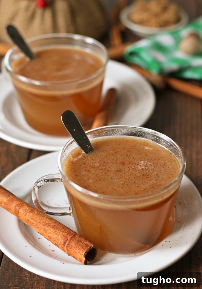 Honey buttered rum served hot with a cinnamon garnish