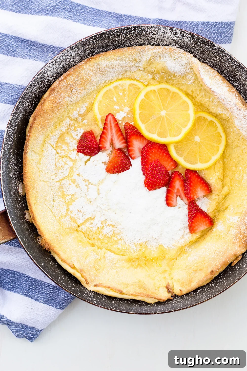 Zesty Lemon Buttermilk Cookies with Raspberry Glaze 11 Lemon Dutch Baby Pancake with Powered Sugar and Strawberries