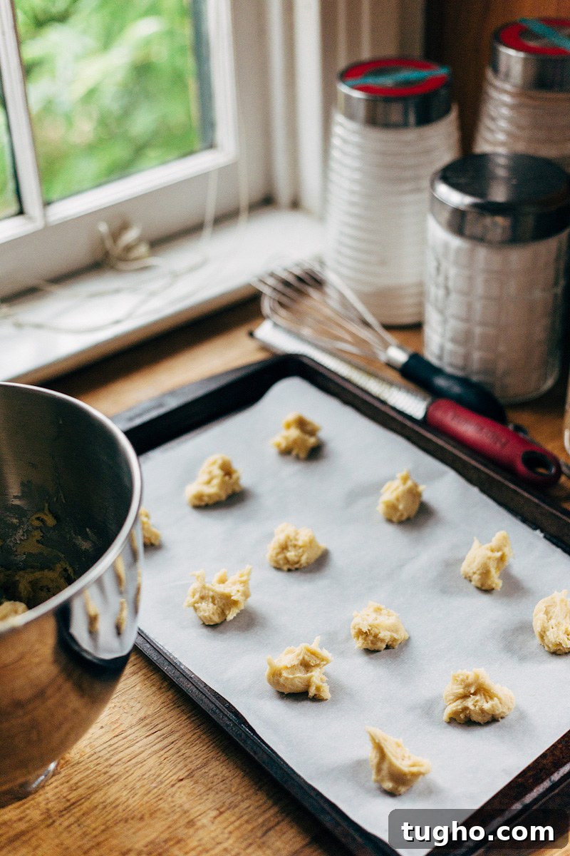 Zesty Lemon Buttermilk Cookies with Raspberry Glaze 3 cookie dough on a baking sheet