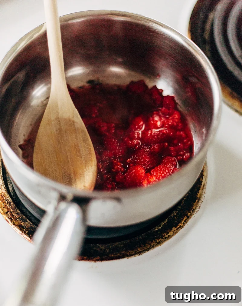 Zesty Lemon Buttermilk Cookies with Raspberry Glaze 4 making raspberry glaze in a pot
