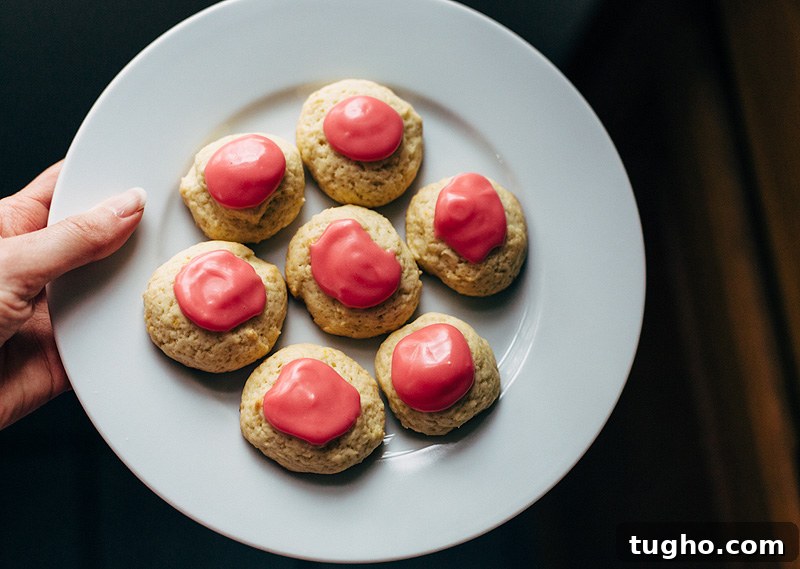 Zesty Lemon Buttermilk Cookies with Raspberry Glaze 8 a plate of lemon buttermilk cookies