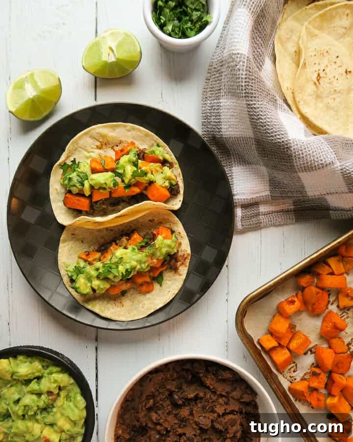 Gluten-Free Vegan Sweet Potato and Black Bean Tacos 2 vegan sweet potato & black bean tacos topped with guacamole and cilantro