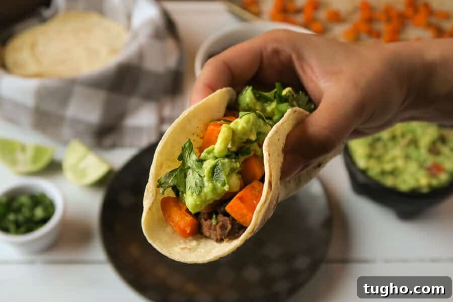 Gluten-Free Vegan Sweet Potato and Black Bean Tacos 5 biteshot of the sweet potato & black bean taco