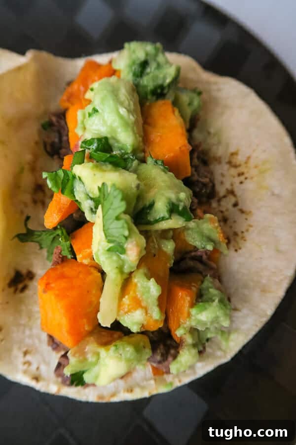 Gluten-Free Vegan Sweet Potato and Black Bean Tacos 3 closeup of a vegan sweet potato & black bean taco