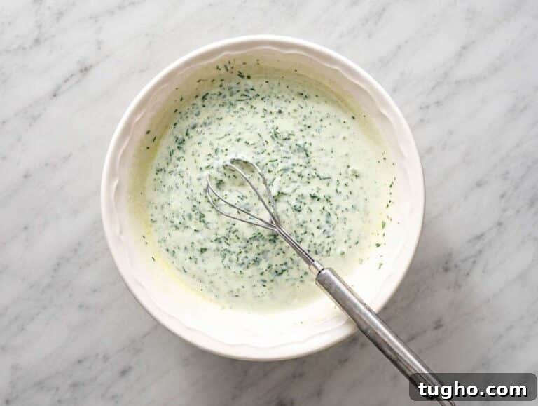 Step 2 Creamy cilantro lime dressing whisked in a small bowl.
