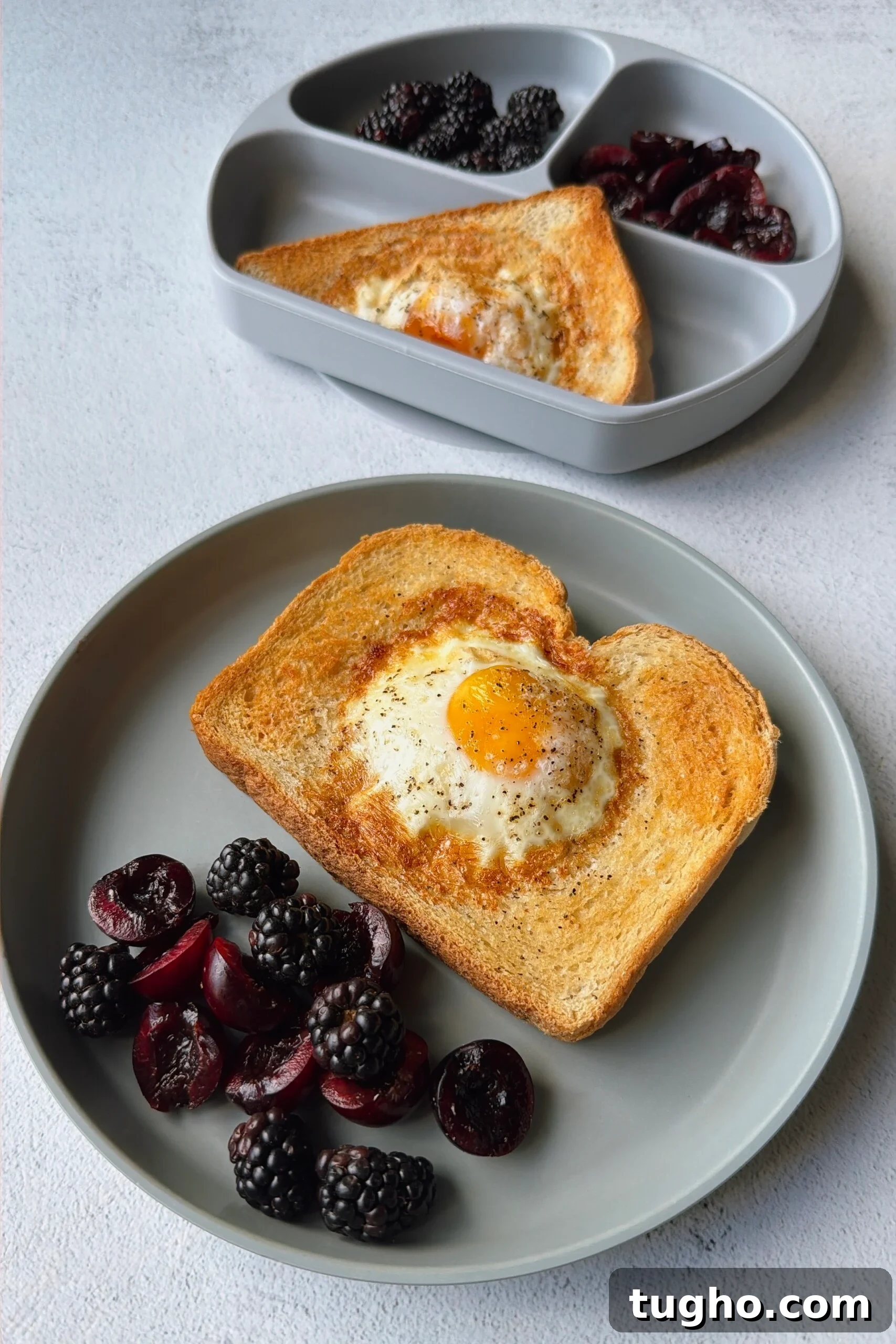 Quick Air Fryer Egg Toast Recipe 2 Air fryer egg toast served with blackberries and cherries.