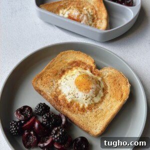 Quick Air Fryer Egg Toast Recipe 11 Air fryer egg toast served with blackberries and cherries.
