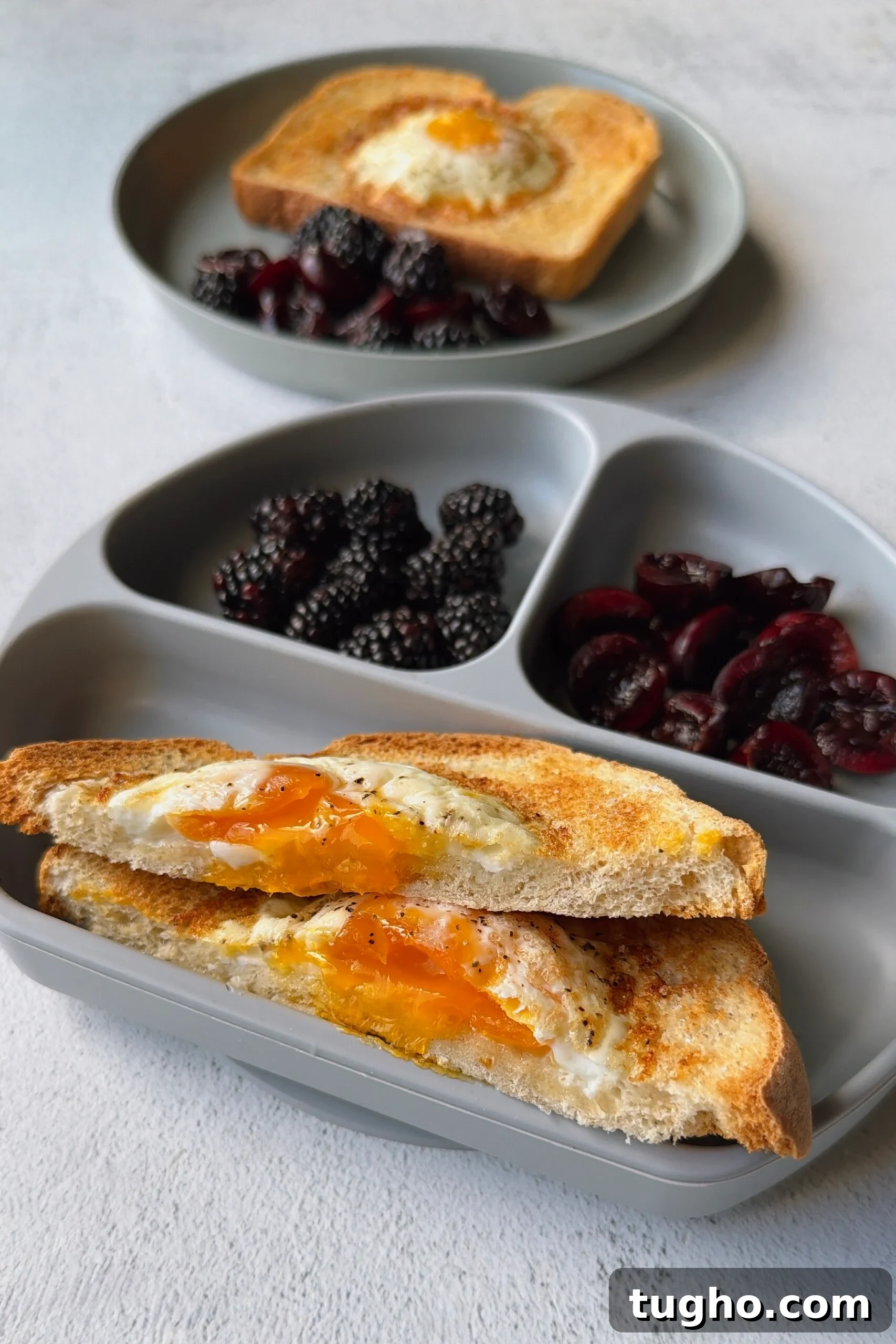 Quick Air Fryer Egg Toast Recipe 5 Air fryer egg toast served with blackberries and cherries.