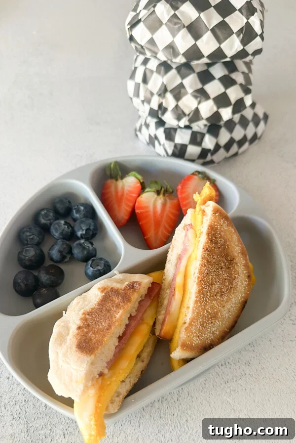 Freezer breakfast sandwich served with berries.