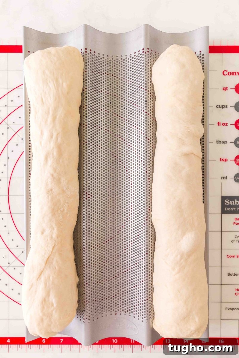 French Baguette Recipe: Make Two Loaves at Home 12 Two shaped baguette loaves on a French bread pan after the second rise. – Hostess At Heart