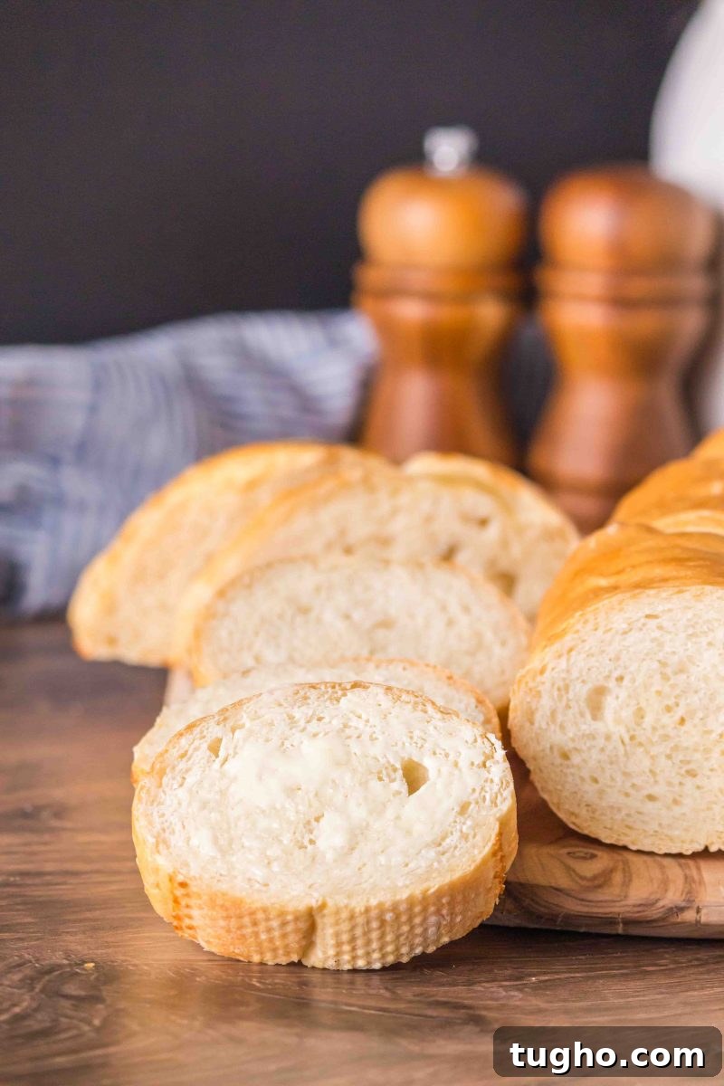 French Baguette Recipe: Make Two Loaves at Home 15 Close-up of sliced homemade French bread baguette showing soft crumb and crispy crust – Hostess At Heart- Hostess At Heart