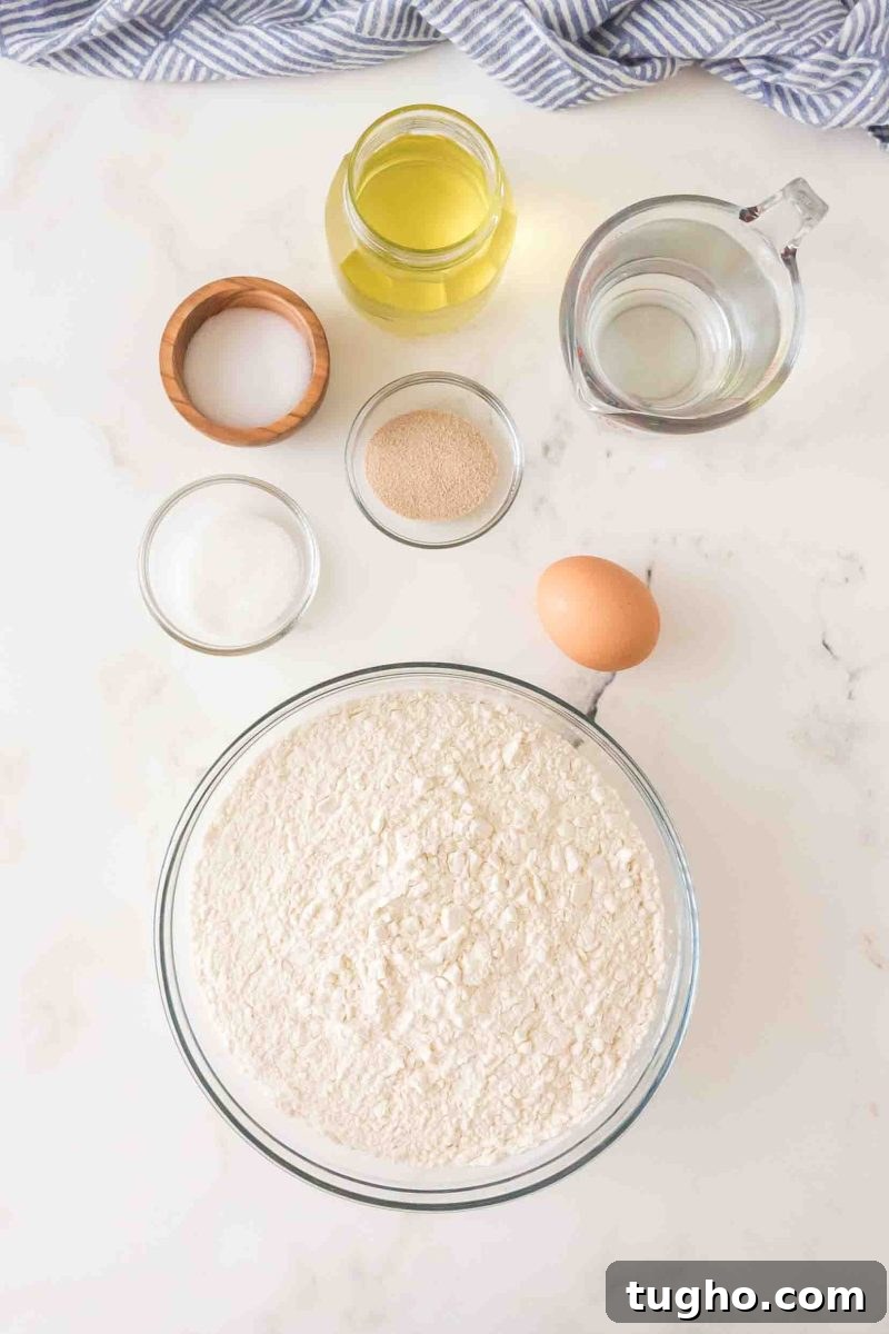French Baguette Recipe: Make Two Loaves at Home 3 French bread ingredients: flour, yeast, warm water, olive oil, salt, sugar, and egg – Hostess At Heart
