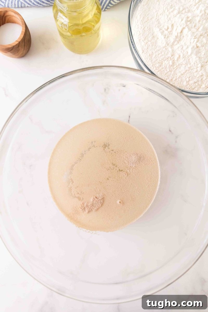 French Baguette Recipe: Make Two Loaves at Home 4 Foamy, activated yeast mixture in warm water in a mixing bowl – Hostess At Heart