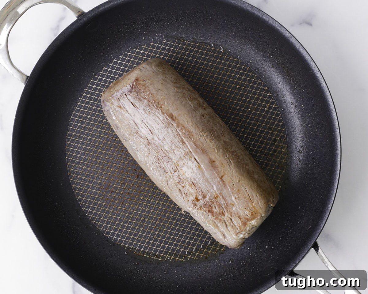 Classic Beef Wellington Recipe 5 Seared beef tenderloin ready for mustard