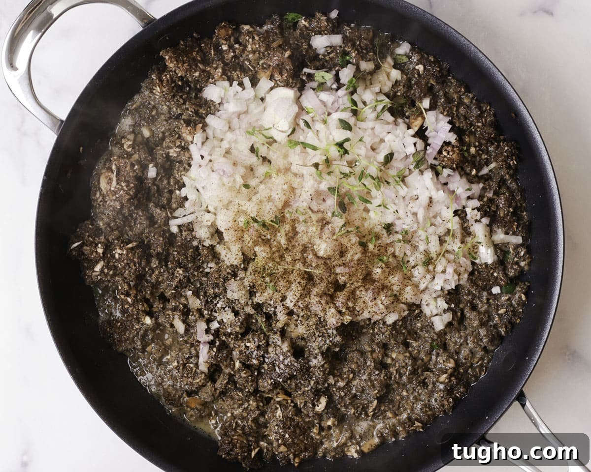 Classic Beef Wellington Recipe 6 Mushroom duxelles cooking in pan