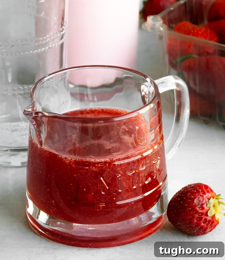 Homemade Strawberry Milk Recipe with Fresh Strawberries 3 A photo of homemade strawberry syrup for milk in a glass
