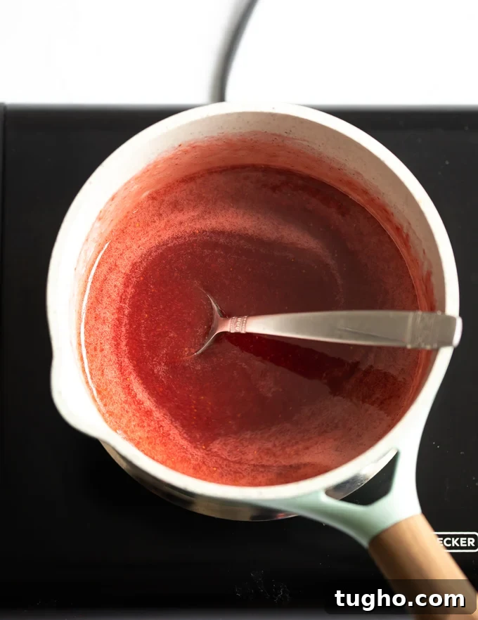Homemade Strawberry Milk Recipe with Fresh Strawberries 7 A photo of a pot of strawberry syrup.