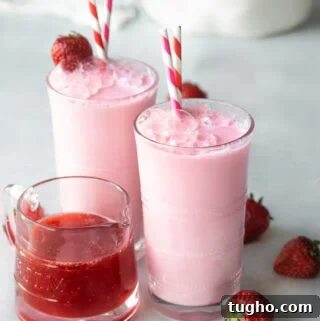 Homemade Strawberry Milk Recipe with Fresh Strawberries 10 Homemade strawberry milk with strawberry syrup in a glass with garnished with a strawberry