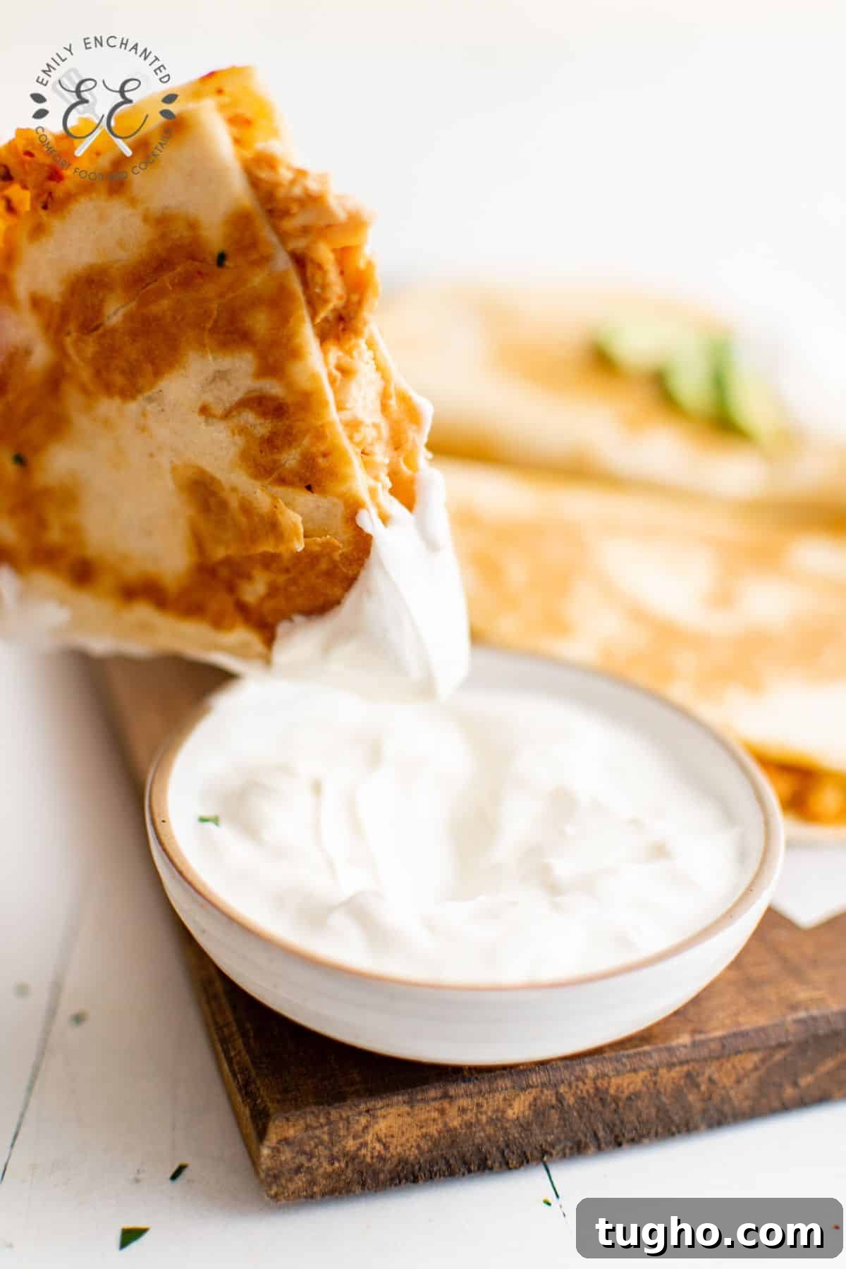 Smoky Chipotle Chicken Quesadilla Recipe 6 Chipotle Chicken Quesadilla dipped in Sour Cream