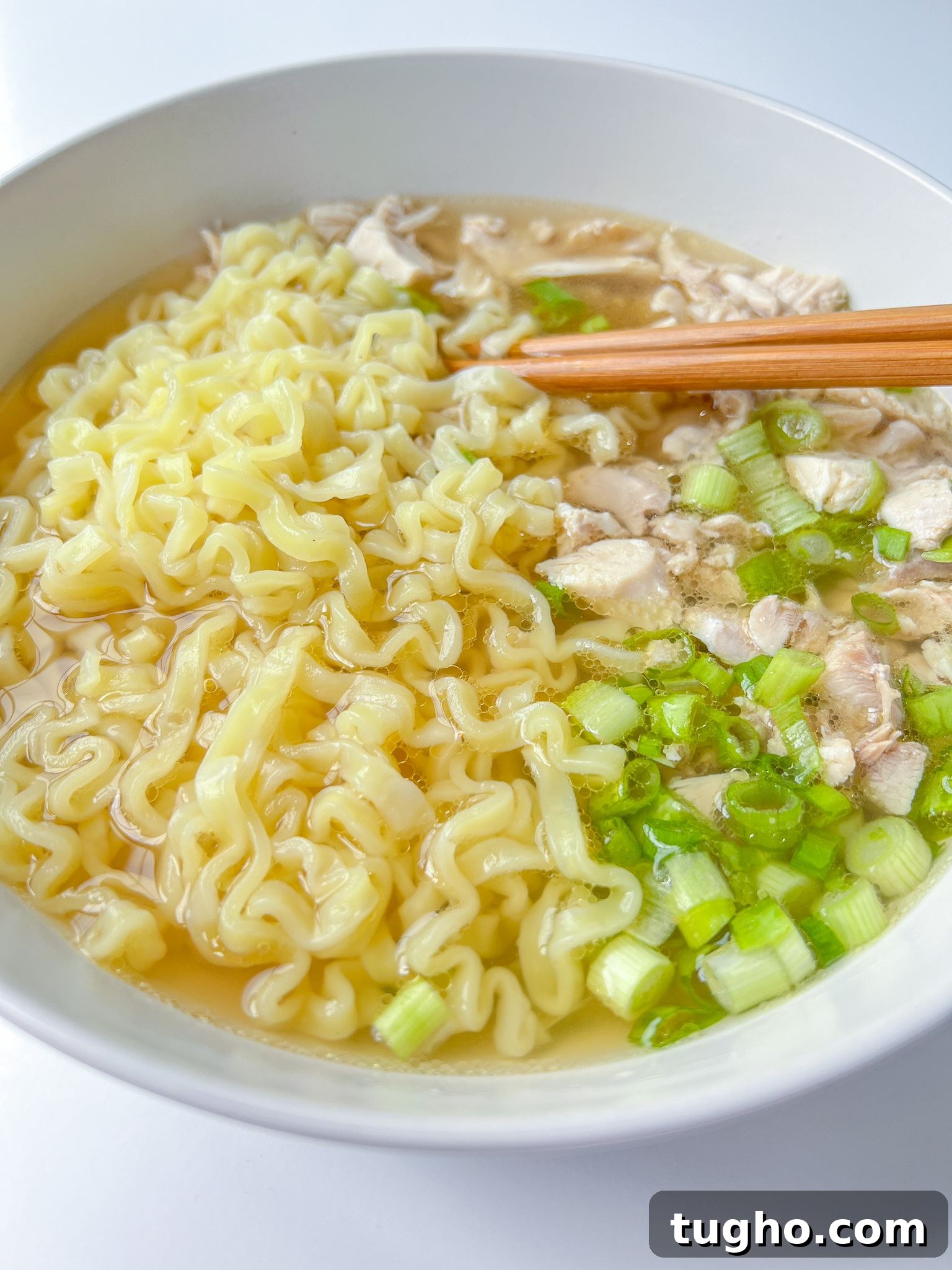 ramen noodle soup in a bowl with chopsticks