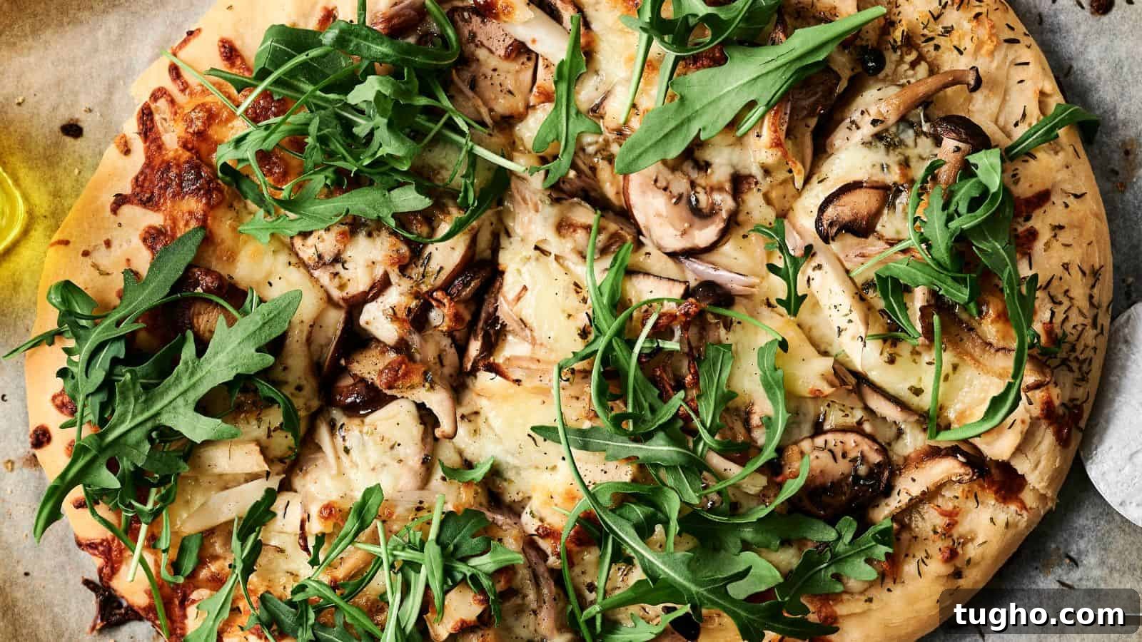 15 Copycat Recipes That Outshine Restaurant Meals 15 Close-up of a pizza topped with arugula, mushrooms, cheese, and herbs on a parchment paper.