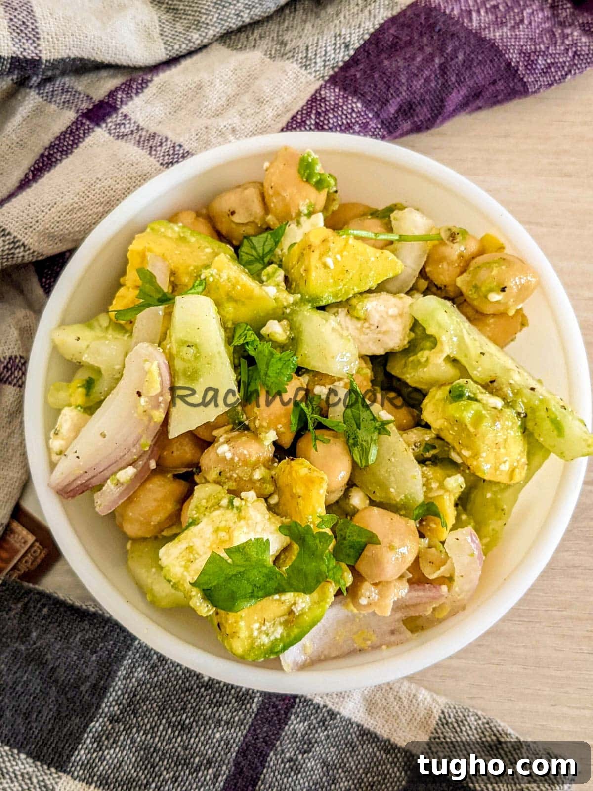 Zesty Chickpea and Cucumber Salad with Lemon Dressing 2 A bowl of chickpea avocado cucumber salad with feta
