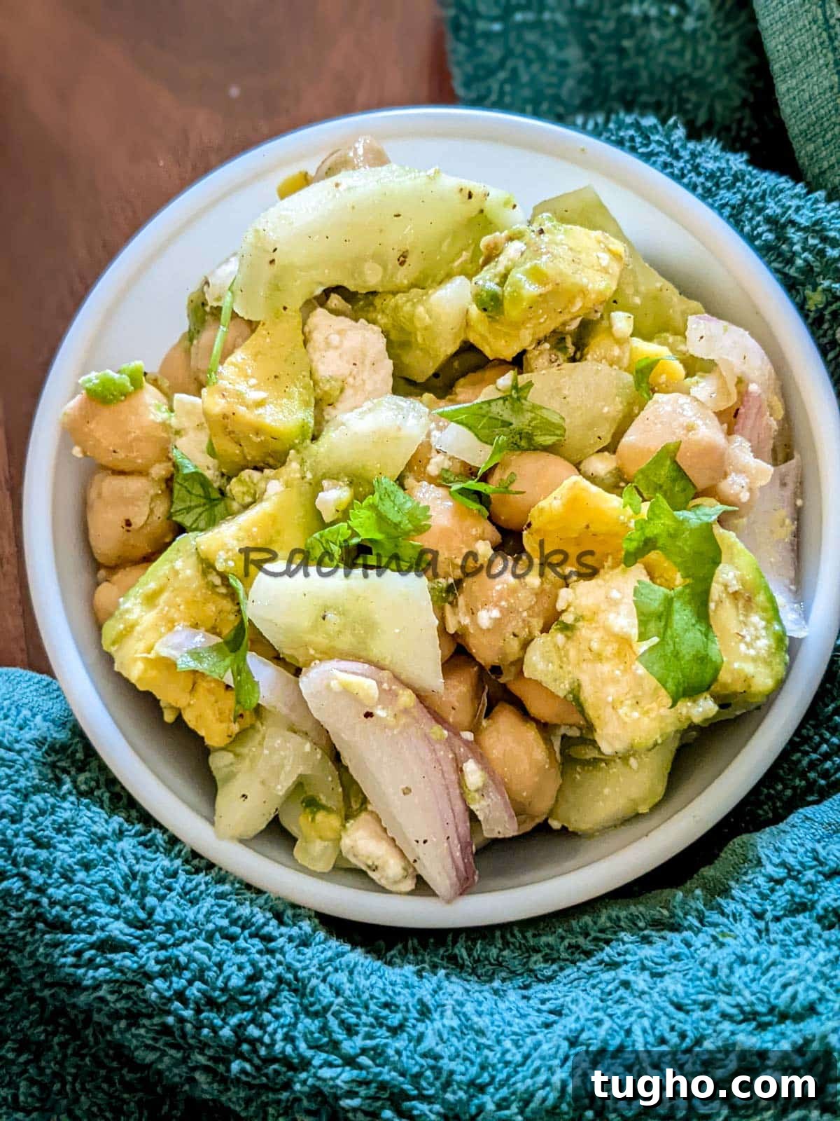 Zesty Chickpea and Cucumber Salad with Lemon Dressing 3 A bowl of chickpea avocado cucumber salad with feta