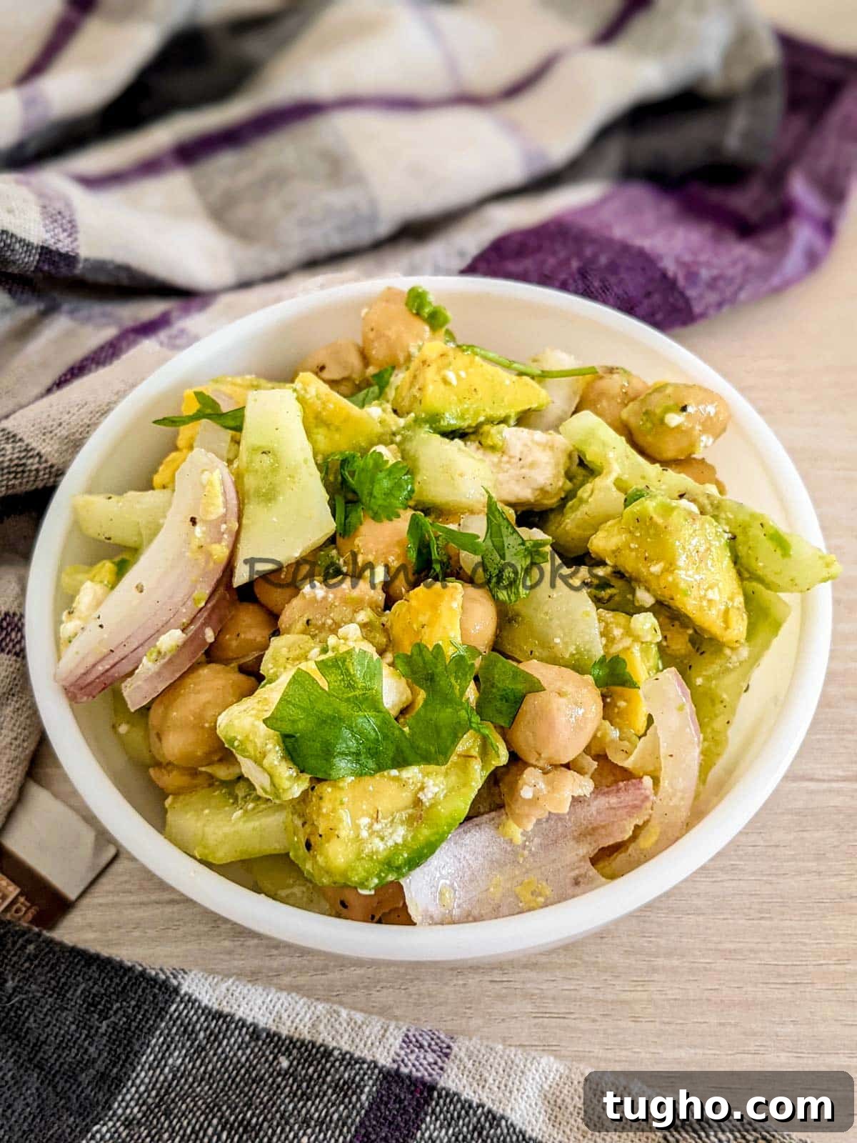 Zesty Chickpea and Cucumber Salad with Lemon Dressing 4 A bowl of chickpea avocado cucumber salad with feta