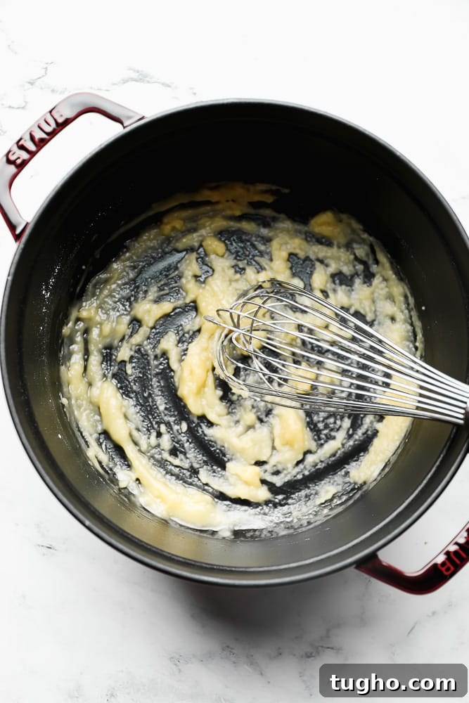 whisking flour, butter in a pot