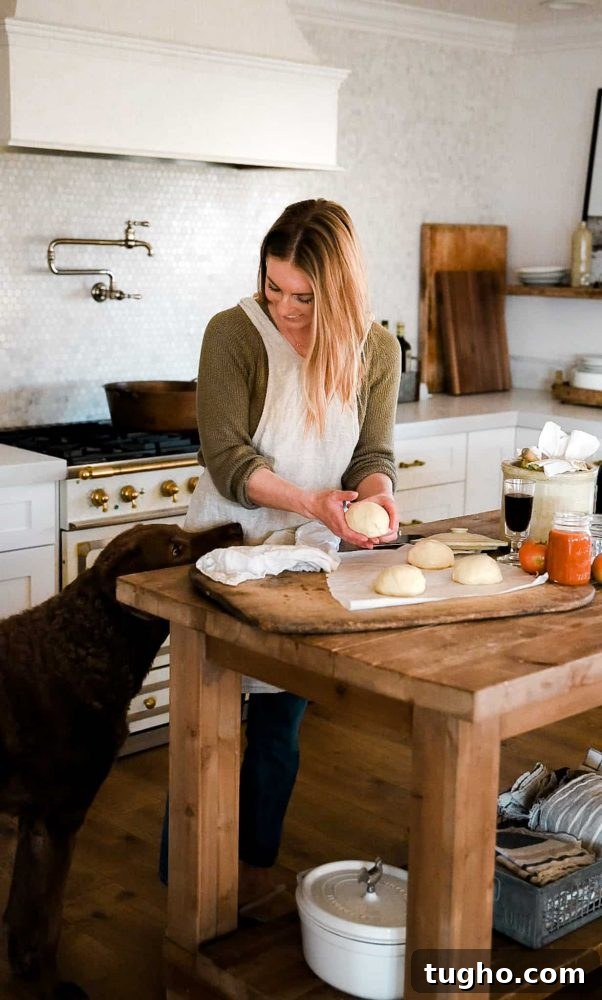 Homemade Pizza Dough Recipe for Family Pizza Night 3 Pizza dough being made in a bright kitchen on wood table
