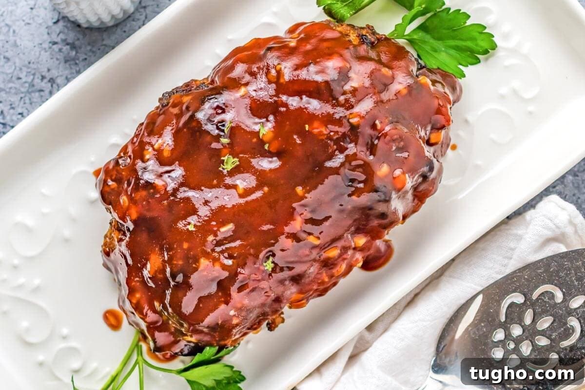 Juicy Air Fryer Meatloaf with Glaze 3 Air Fryer Meatloaf on a white platter
