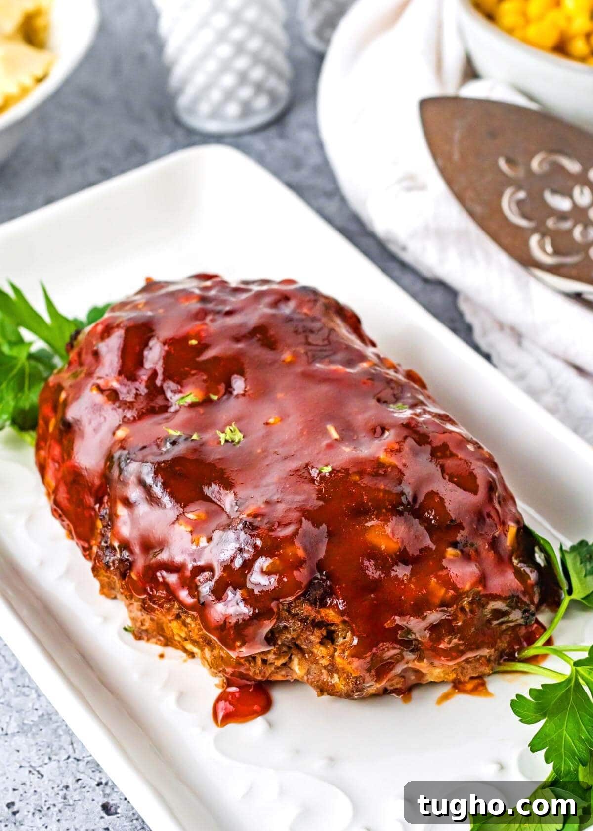 Juicy Air Fryer Meatloaf with Glaze 7 Air Fryer Meatloaf on a white platter