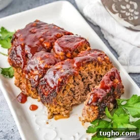 Juicy Air Fryer Meatloaf with Glaze 10 Air Fryer Meatloaf on a white plate