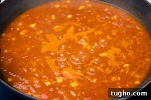 Leftover Turkey Curry with Coconut and Warm Spices 7 Curry sauce boiling in a pan