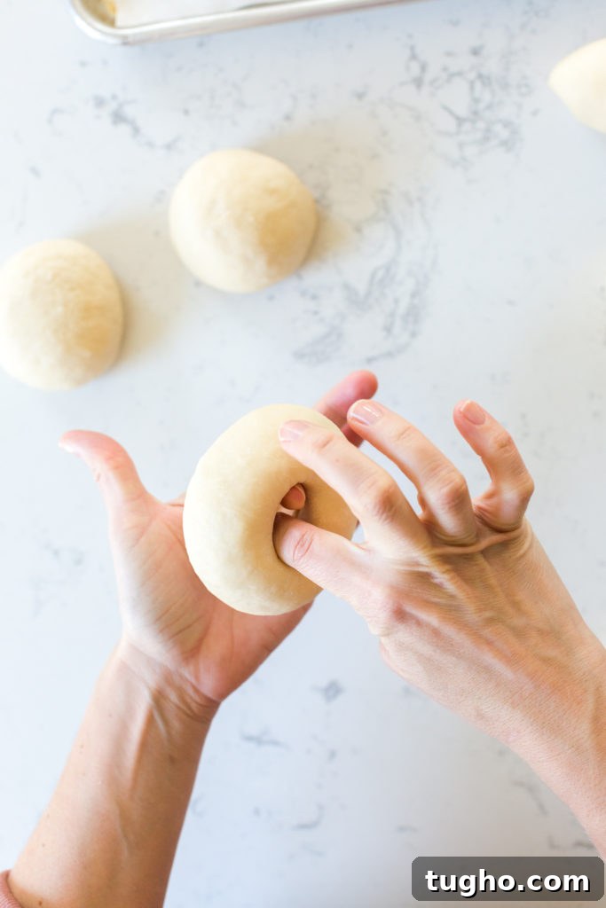 Spinning bagel dough to widen the hole