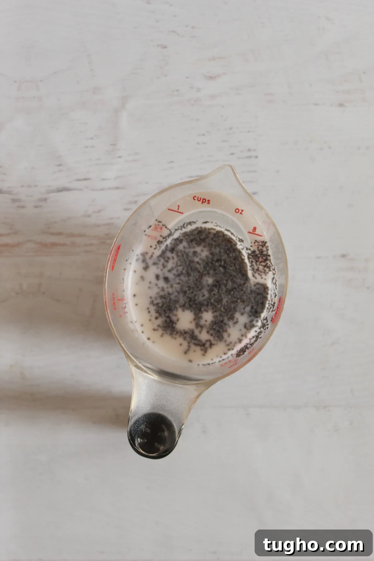milk and poppy seeds in a cup