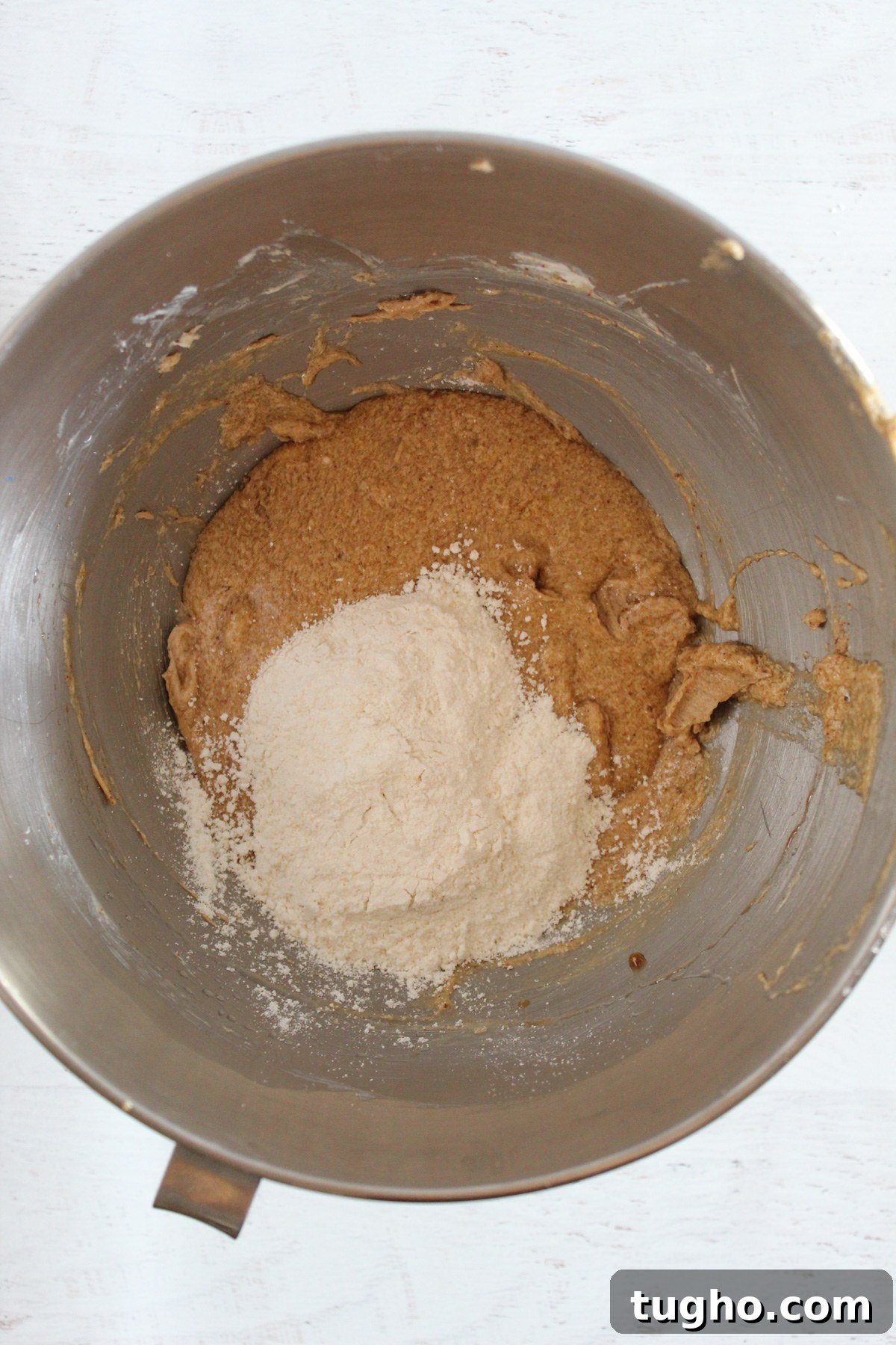 alternating flour in a stand mixer bowl