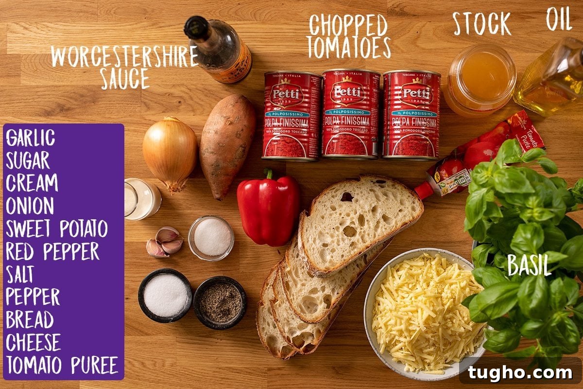 Creamy Homemade Tomato Soup Recipe 3 Ingredients for tomato soup with basil-topped cheese on toast on a wooden table